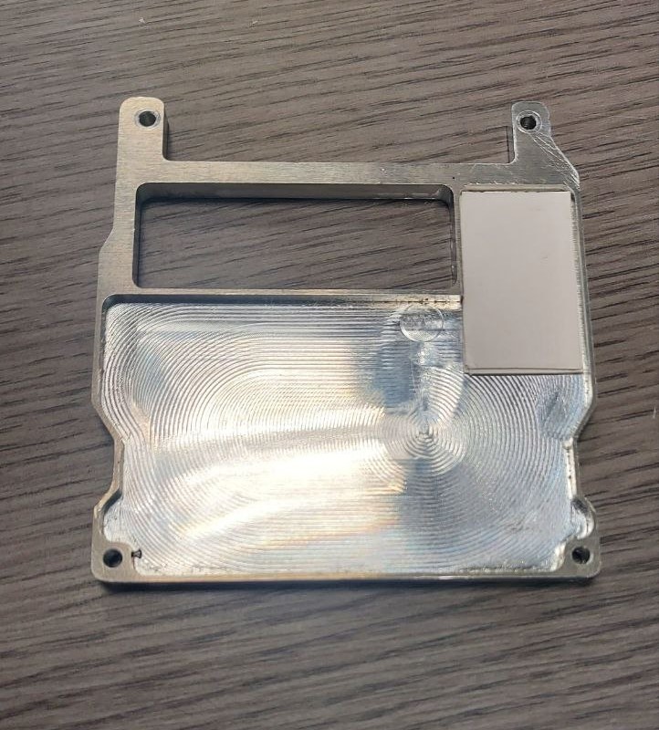 Thermal pad applied to underside of shield cover